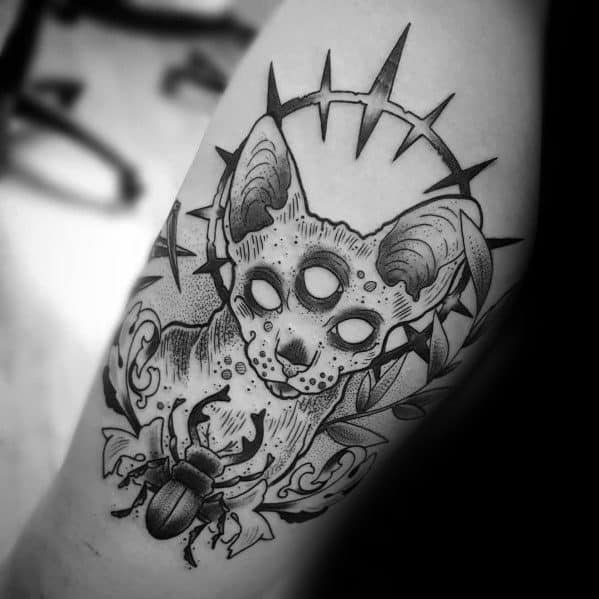 Surreal blackwork cat tattoo featuring a three-eyed Sphynx, thorn crown, and scarab beetle for a bold and mystical design.