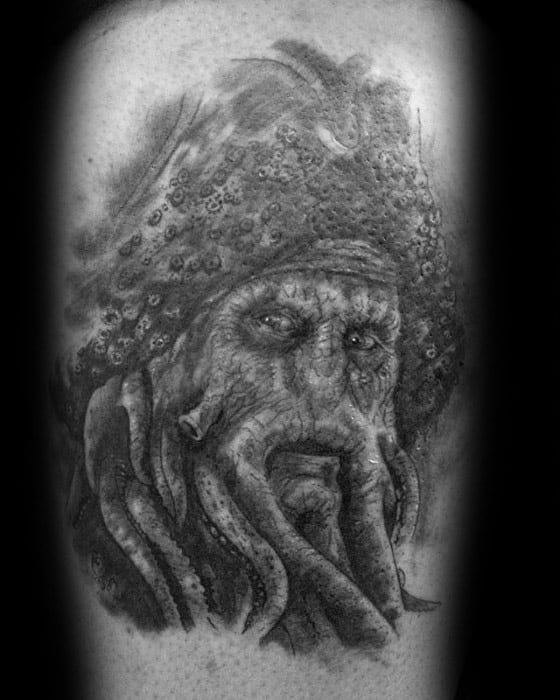 Black and white tattoo of Davy Jones' mythical sea creature with tentacles on an arm