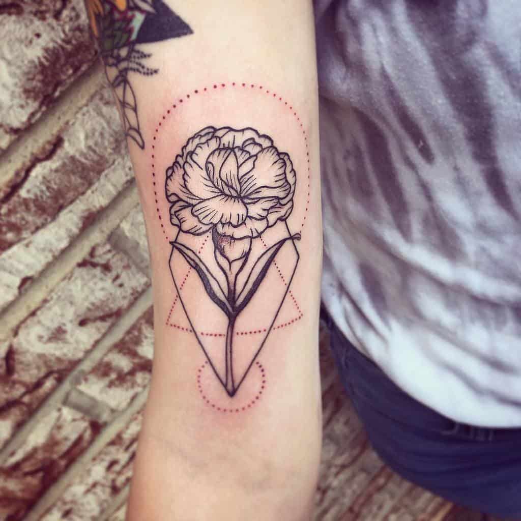 A floral geometric tattoo on an arm, featuring a blooming flower with red dotted outlines and abstract shapes