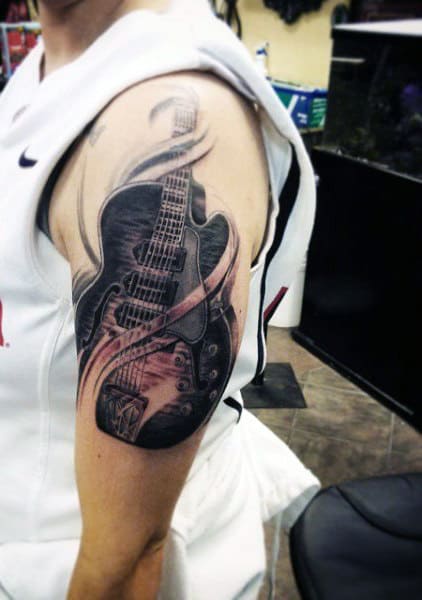 Arm Gibson Guitar Tattoo On Men