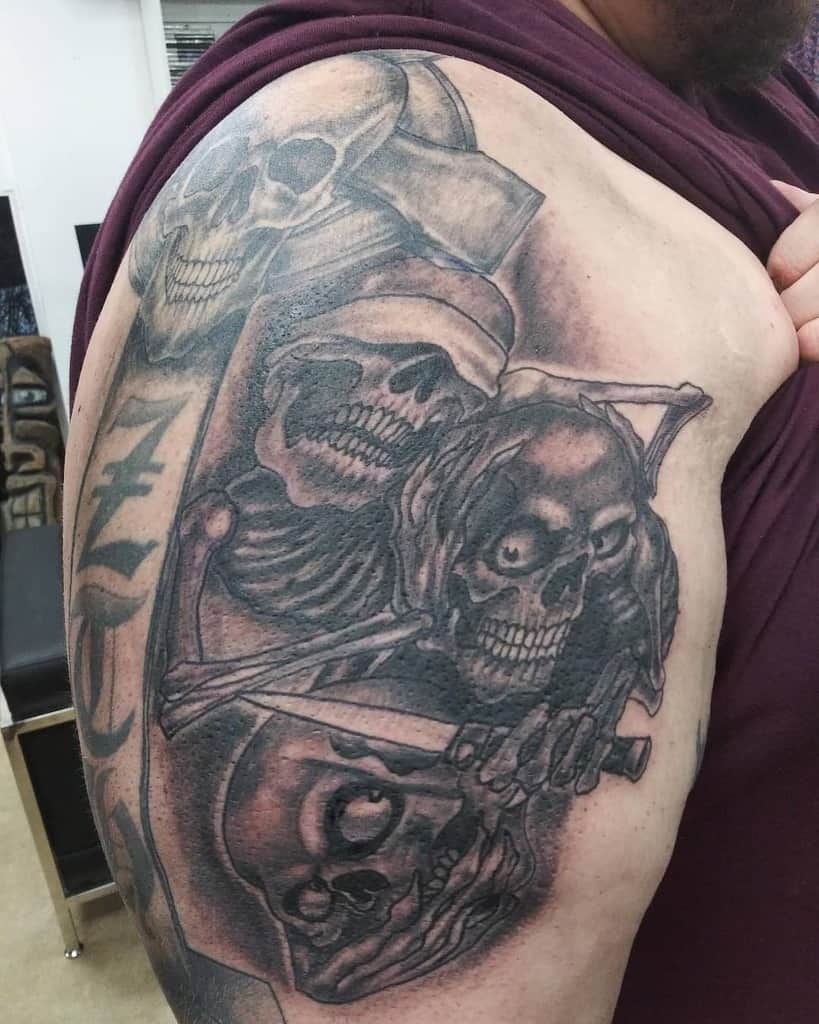 Detailed arm tattoo featuring three skulls in a dramatic black and grey style, symbolizing 'Hear No Evil, See No Evil, Speak No Evil'