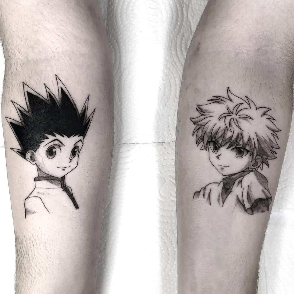 Black-and-grey forearm tattoos of Gon and Killua from Hunter x Hunter, capturing their iconic expressions in a clean and minimalist design