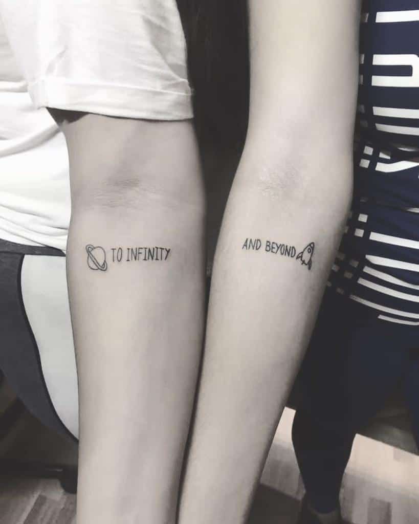 Matching sister tattoos with 'To Infinity' and a planet on one arm, and 'And Beyond' with a rocket on the other, inspired by Toy Story