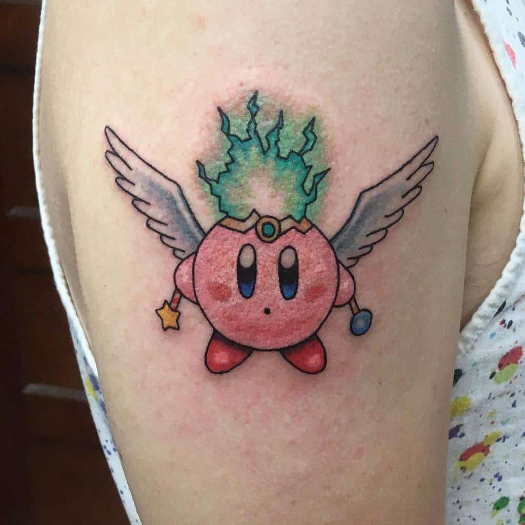 Kirby tattoo with angel wings, a glowing green flame crown, and a magic wand, a celestial and mystical design with soft shading