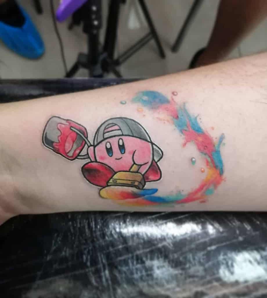 Kirby tattoo wearing a cap, holding a paintbrush and roller, creating a colorful paint swirl, a playful and artistic design