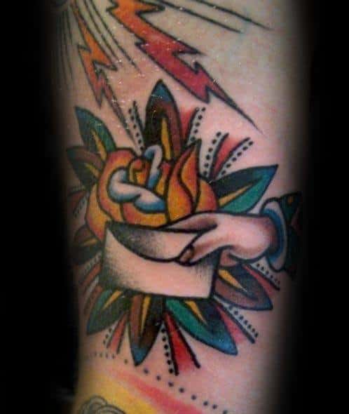 Envelope tattoo of a hand with colorful flowers and striking lightning bolts