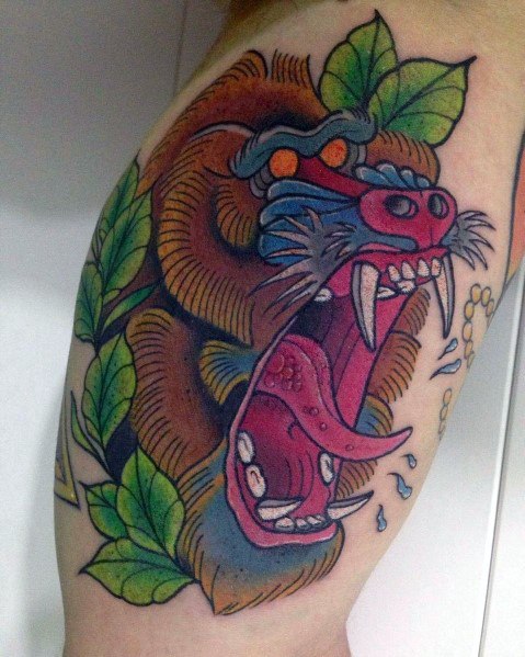 Traditional-style baboon tattoo with bold outlines, vibrant colors, and fierce expression, featuring jungle elements and dynamic details.