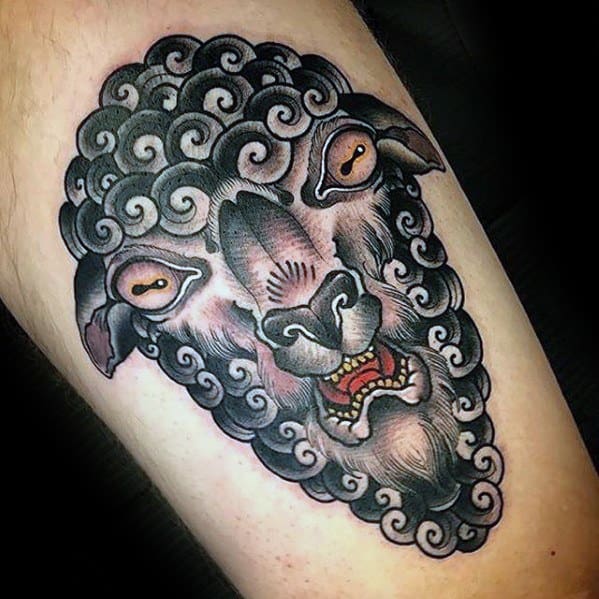 Tattoo of a stylized goat head with curly fur and an intense expression