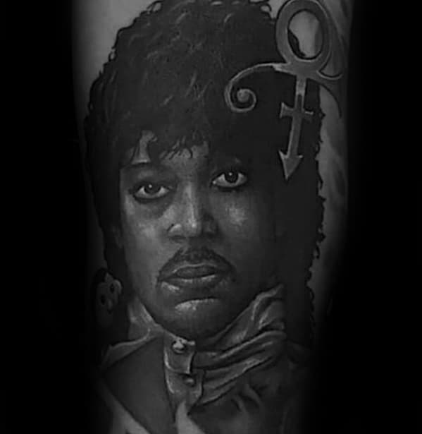 Black and white tattoo of a Prince with a symbol above their head