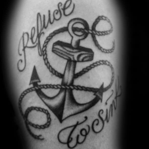 Tattoo of an anchor with "Refuse To Sink" elegantly scripted around it