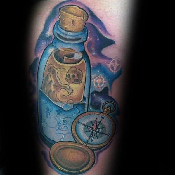 Tattoo of a message in a bottle with a skull inside the bottle and a compass beside it