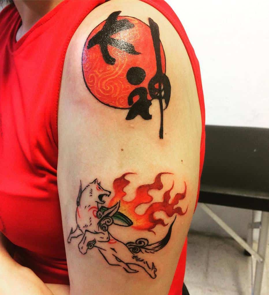 Stylized Okami tattoo featuring Amaterasu with fiery divine energy and a bold red sun with Japanese kanji on the shoulder
