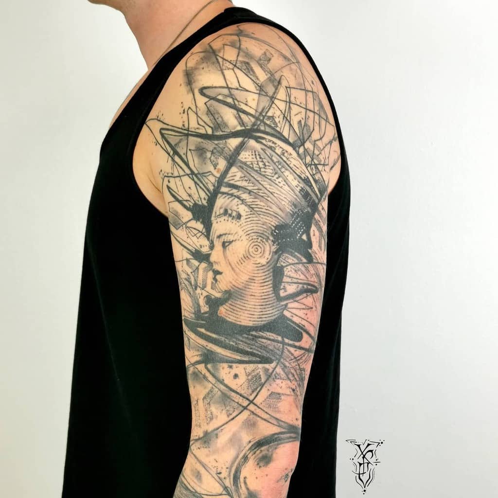 Abstract Nefertiti sleeve tattoo with dynamic linework and shading, blending ancient elegance with modern artistic flair
