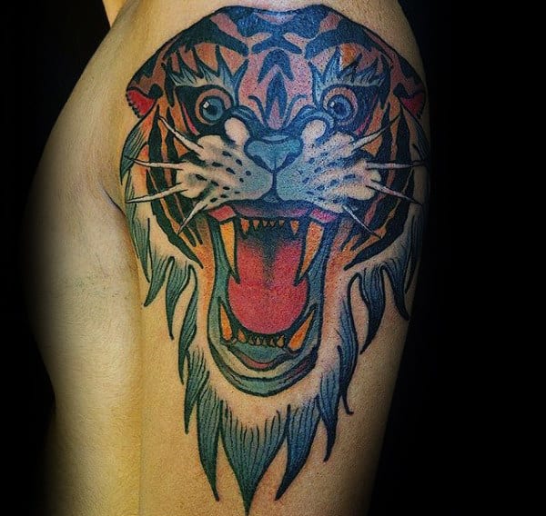 Colorful tattoo of a roaring tiger's head on an upper arm