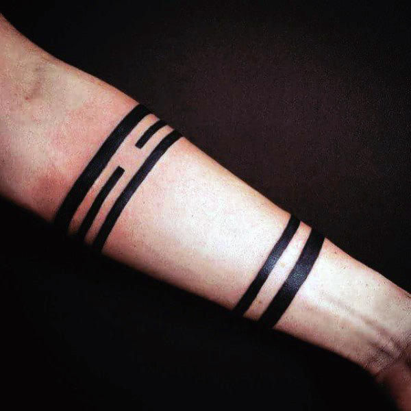 Forearm with bold, geometric black line tattoos