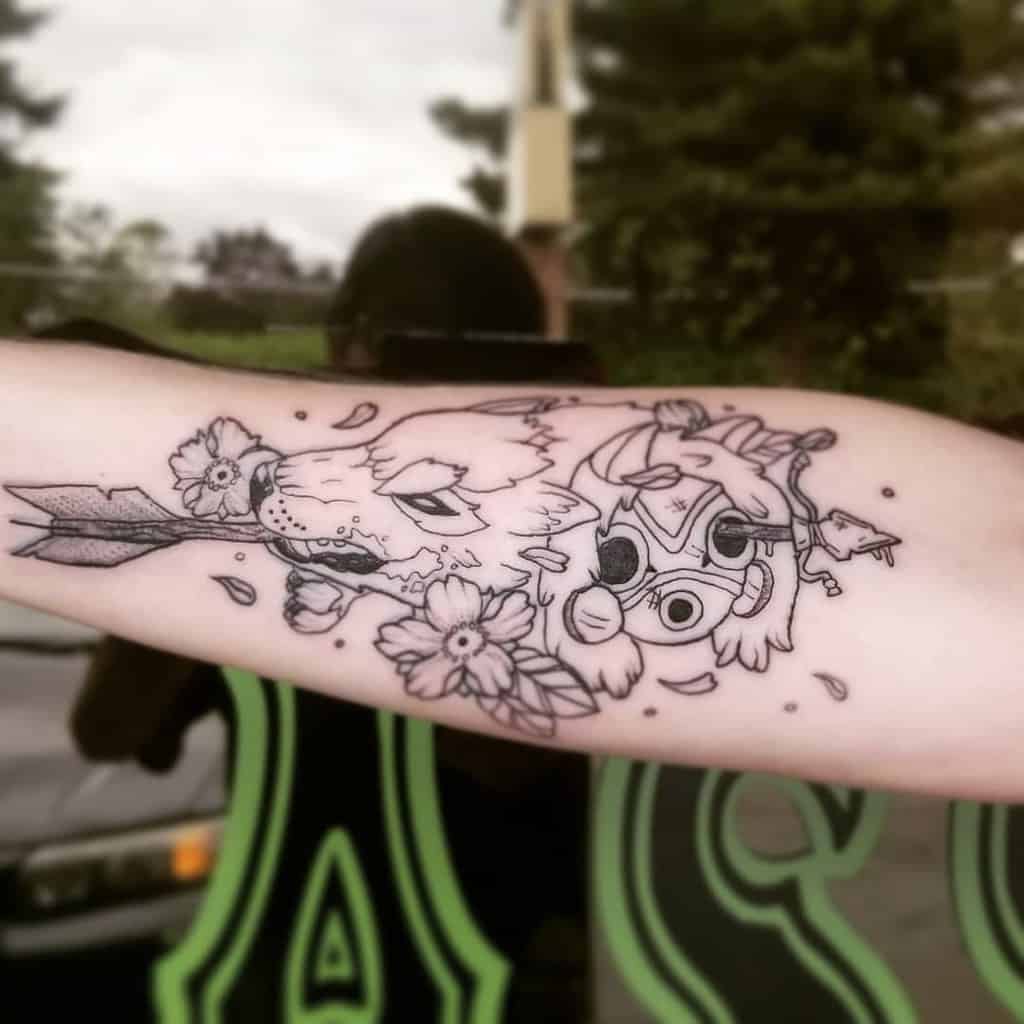 Black ink forearm tattoo of Moro biting an arrow, with San’s mask, flowers, and falling petals in a delicate line-art style.
