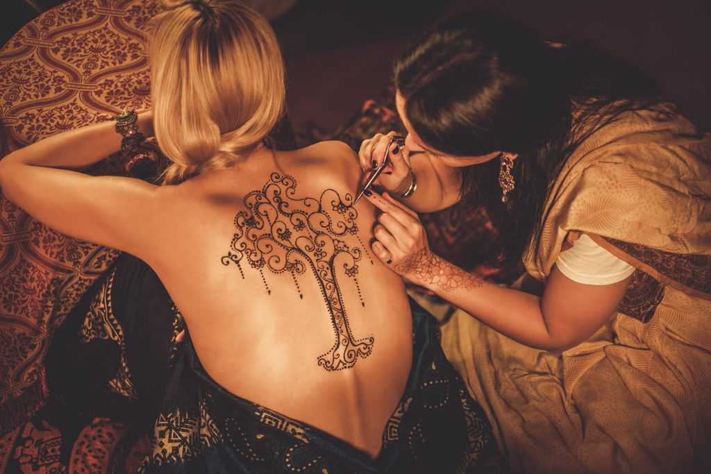 Artist Applies Henna Tattoo Tree Of Life Back