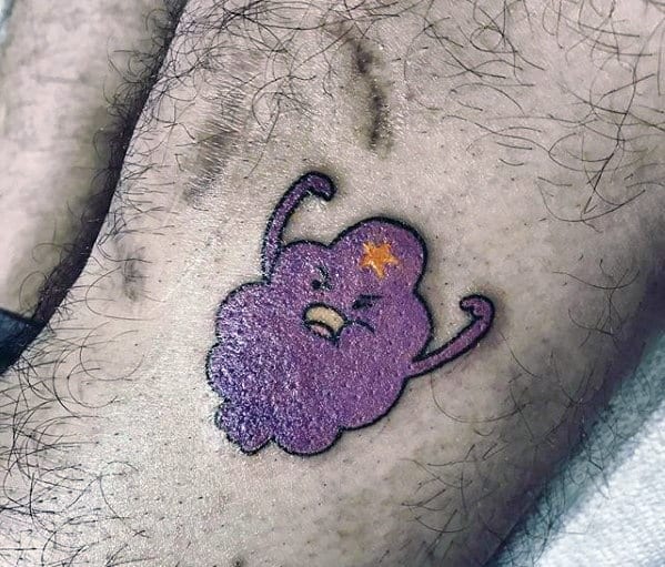 Small Adventure Time tattoo of Lumpy Space Princess with raised arms and an angry expression, placed on the inner thigh.