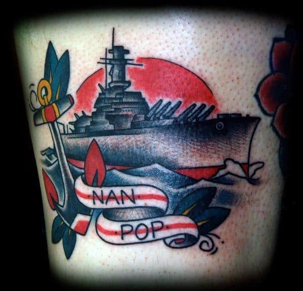 Battleship tattoo with anchor, waves, and "Nan Pop" on a red sun background
