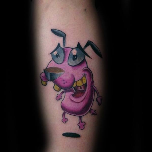 Colorful Courage the Cowardly Dog tattoo showing him smiling with big eyes and teeth, standing happily above a small shadow.