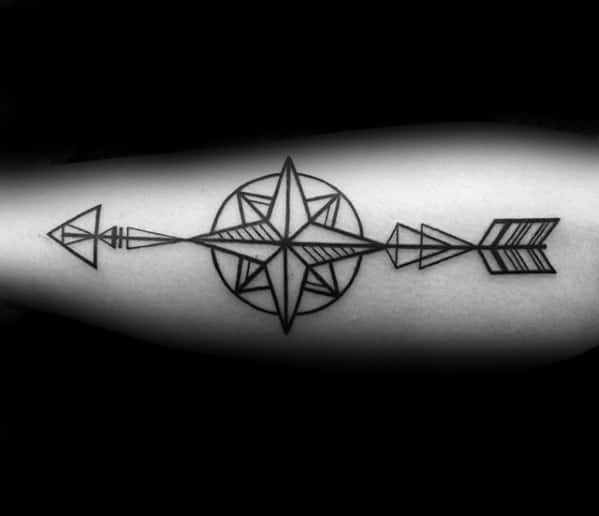 Geometric arrow tattoo with a central compass rose, clean linework, and symmetrical arrow elements on the forearm.