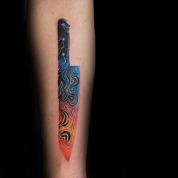 Knife-shaped gradient tattoo with abstract topographic patterns in blue, purple, red, orange, and yellow tones.
