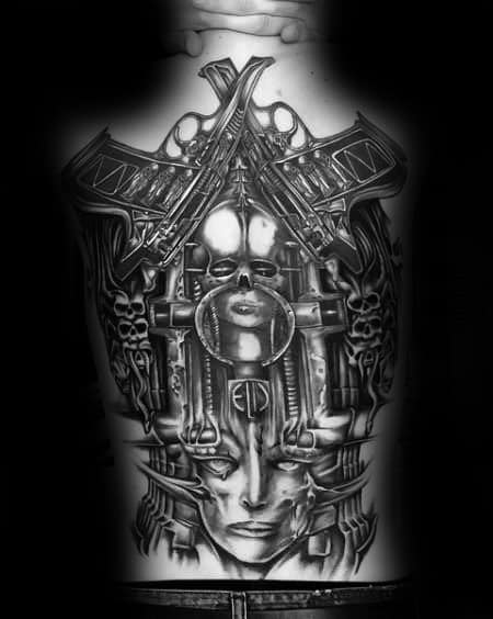 Large biomechanical tattoo inspired by HR Giger, featuring futuristic skulls, machinery, and a central female face motif.