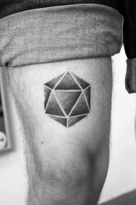 Dotwork icosahedron tattoo on upper thigh, showcasing a shaded geometric style with clean triangular facets.