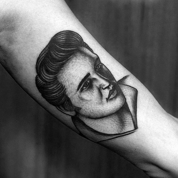 Geometric-style Elvis Presley tattoo with fine line shading, capturing his classic profile and signature hairstyle.