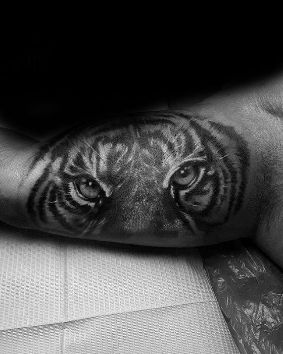Artistic Male Inner Arm Bicep Tiger Eyes Tattoo Ideas
