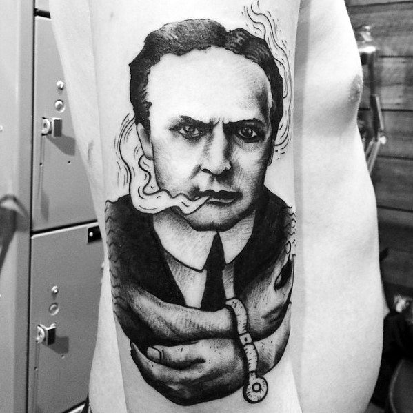 Tattoo of Harry Houdini with smoke and handcuffs on the arms