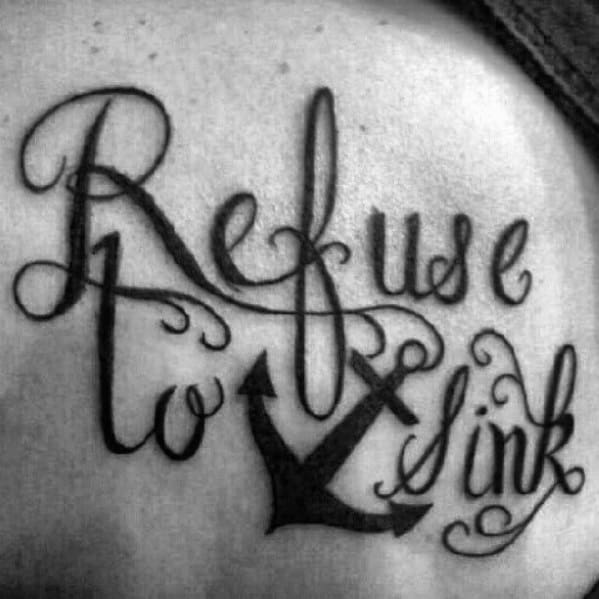Black and gray tattoo of the phrase "Refuse to Sink" with elegant script and an anchor design