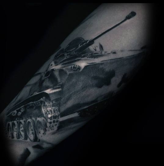 Realistic black and grey tattoo of a military tank in motion, with fine shading and dramatic lighting for depth and intensity.