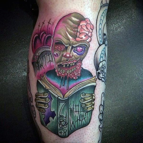 Artistic Zombie Reading Book With Tombstones Male Tattoo On Leg