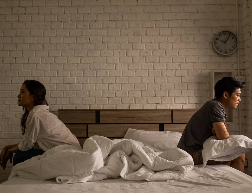 asian couple stop talking to each other in bedroom