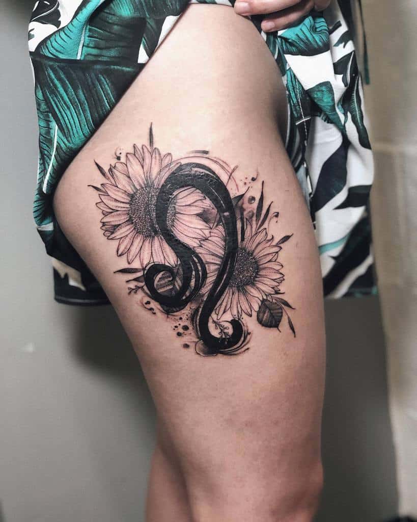 Thigh tattoo of two sunflowers intertwining with a bold, leo black design
