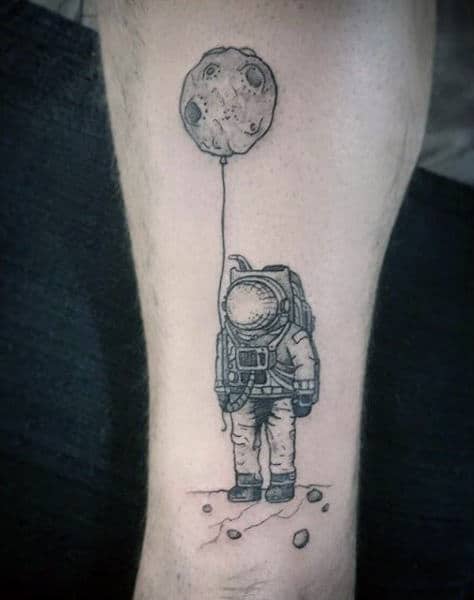 Astronaut With Crater On A String Tattoo On Guys Arms