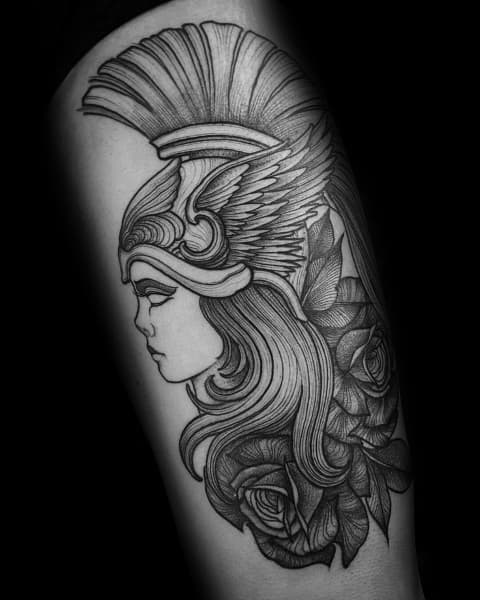 Athena tattoo in profile with a winged helmet, flowing hair, and detailed roses in a clean black and grey linework style