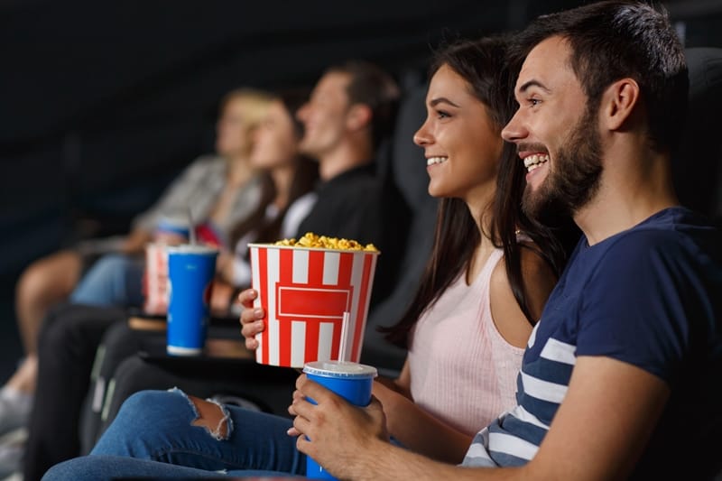 attend a comedy show rainy day date ideas