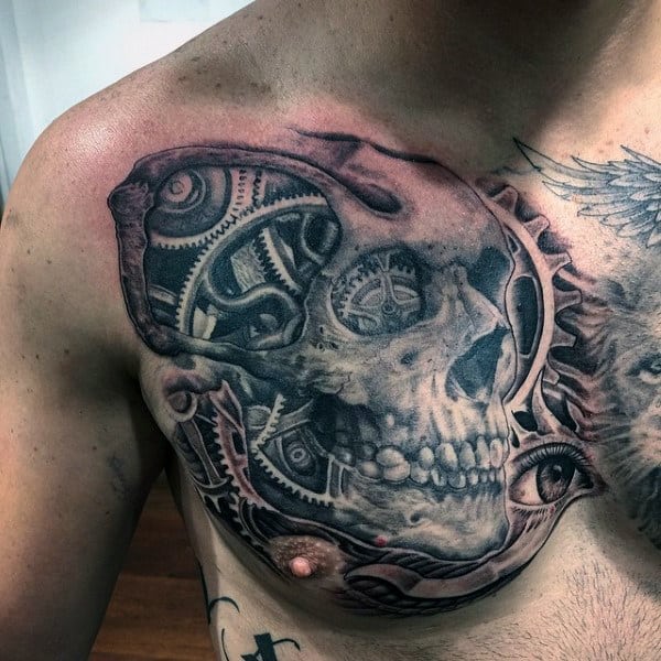 Chest tattoo featuring a detailed biomechanical skull design