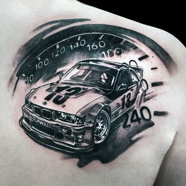 Tattoo of a racing car on a shoulder with a speedometer background