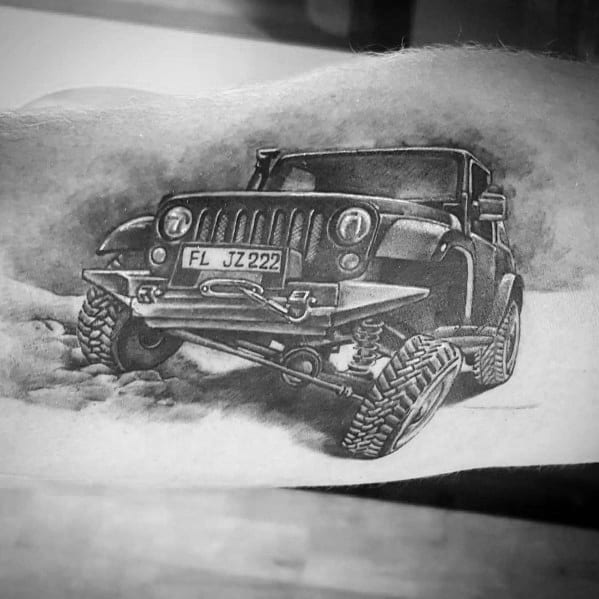 Black and grey Jeep tattoo featuring a highly detailed off-road Jeep with rugged tires, kicking up dirt as it moves through rough terrain.