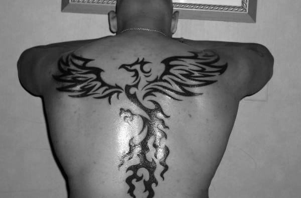 Awesome Back And Spine Male Flaming Phoenix Tribal Tattoos