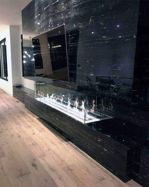 linear fireplace with TV above