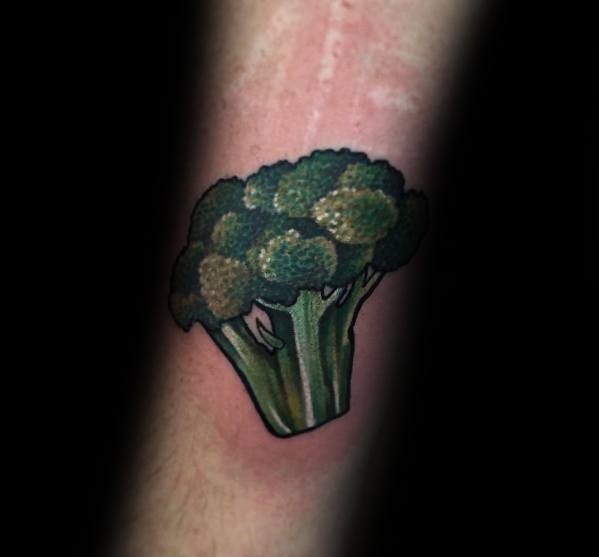 Realistic broccoli tattoo on the forearm, featuring rich green tones and bold outlines for a vibrant and eye-catching design.