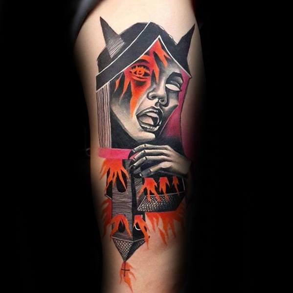 Burning church tattoo featuring a dramatic female face emerging from flames. Bold red and black tones with surreal gothic elements.