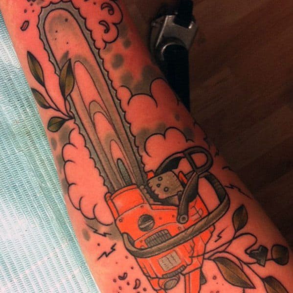 Bold chainsaw tattoo featuring an orange saw with smoke and leafy branches, blending mechanical and nature-inspired elements.