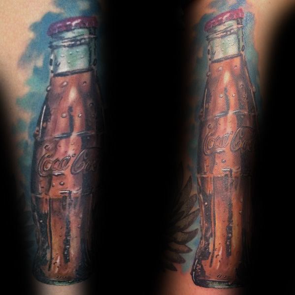 Hyper-realistic Coca-Cola bottle tattoo with condensation details, creating a refreshing, lifelike effect on the arm.