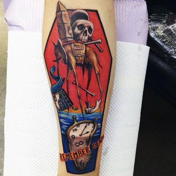 Colorful Salvador Dali-inspired tattoo featuring a long-legged elephant with a skull and crossbones, melting clock, and the words "Remember Death".