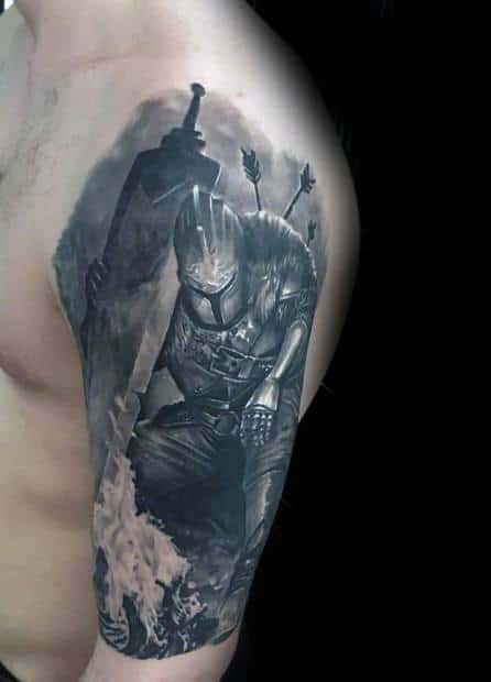 Realistic Dark Souls tattoo of a wounded knight pierced by arrows, gripping a large sword, with flames rising below in grayscale.